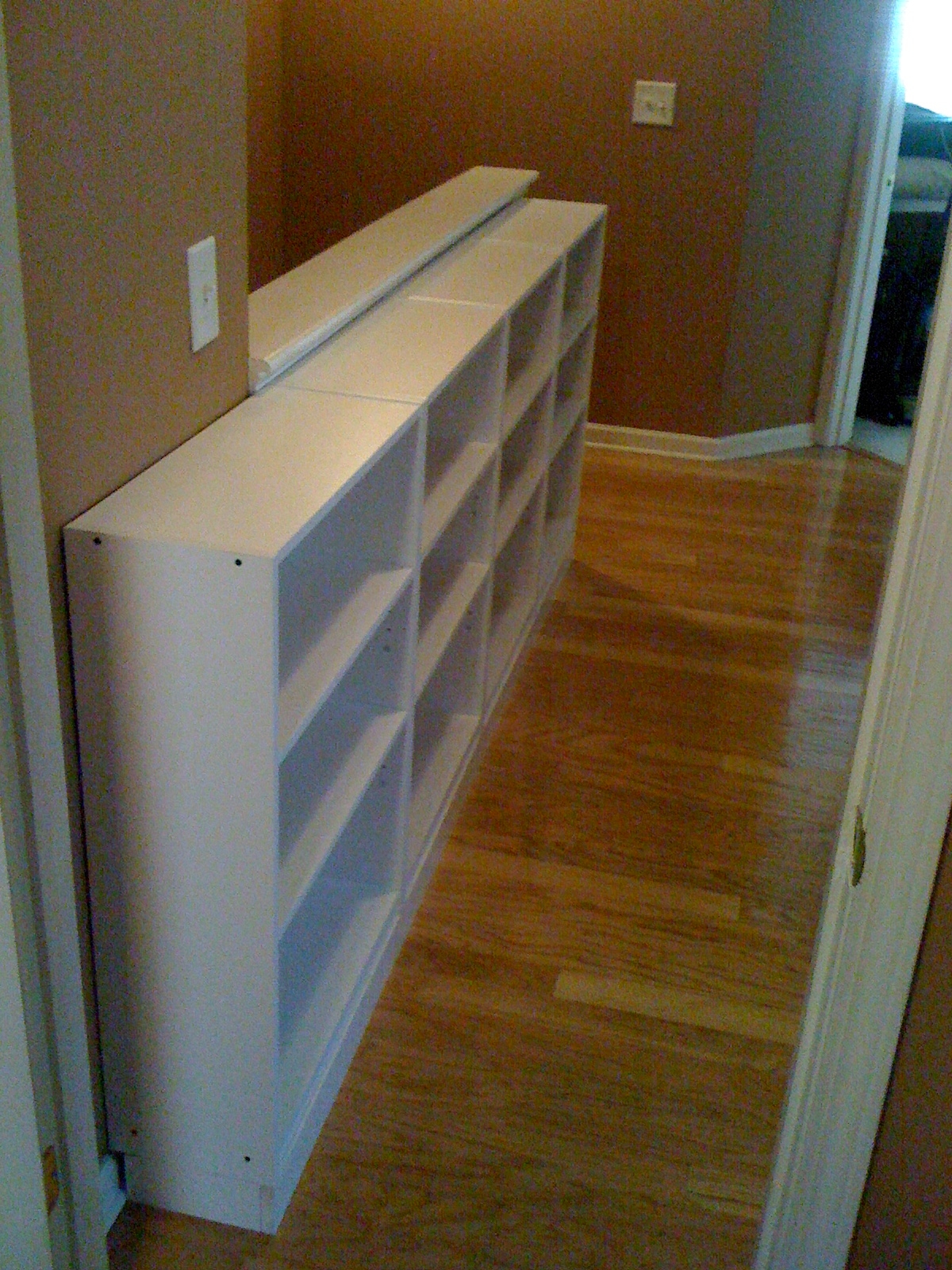 Picture of hallway bookcases facing bedroom